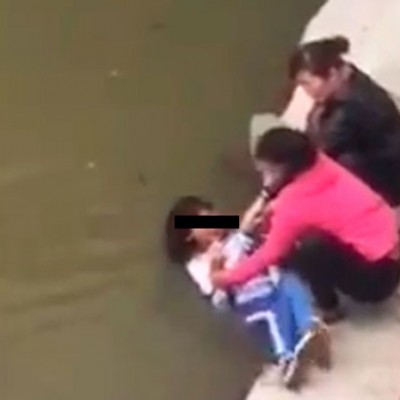  (Video) Madre amenaza a su hija con ahogarla en río por reprobar exámenes
